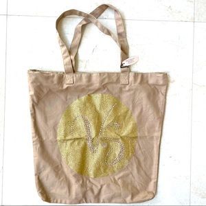 Victoria’s Secret beige and gold tote bag